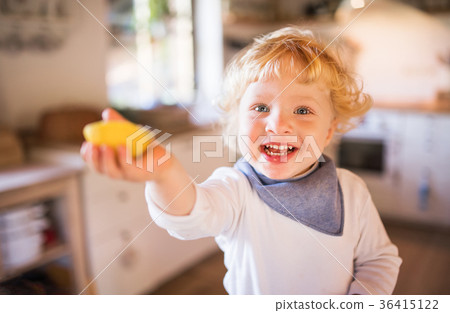 Toddler boy in the kitchen. Toddler boy in the kitchen. 36415122