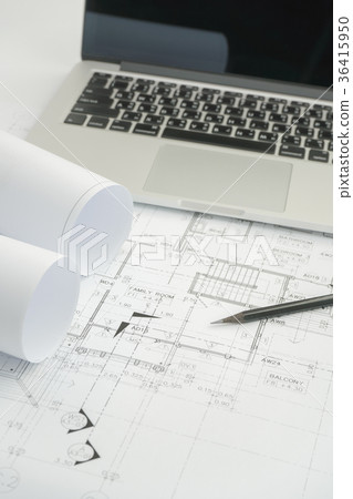pencil and laptop on architectural drawing paper 36415950