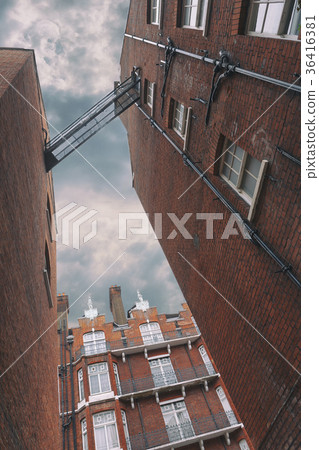 Facades of brick houses in London 36416381