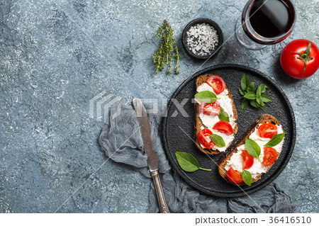 Crostini appetizers with cherry tomatoes Crostini appetizers with cherry tomatoes 36416510