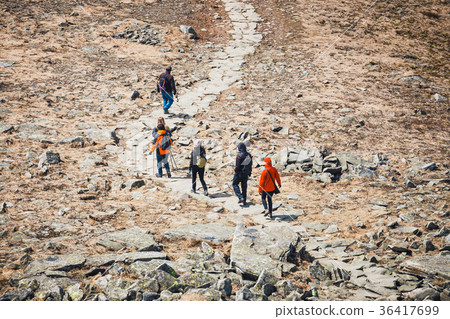 unidentified hikers travel in the Mountains unidentified hikers travel in the Mountains 36417699