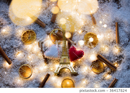 Eiffel tower toy with two hearts and lemons with cinnamons 36417824