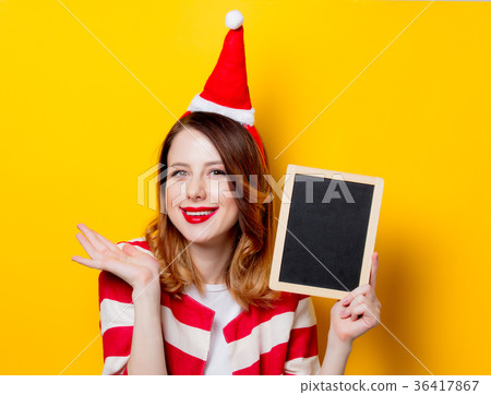 woman in Santa Claus hat with blackboard woman in Santa Claus hat with blackboard 36417867
