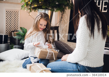 Merry Christmas and Happy Holidays. Cheerful mom Merry Christmas and Happy Holidays. Cheerful mom 36418914