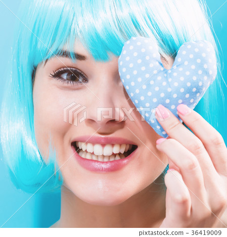 Beautiful woman in a bright blue wig Beautiful woman in a bright blue wig 36419009