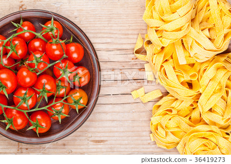 uncooked pasta and fresh tomatoes uncooked pasta and fresh tomatoes 36419273