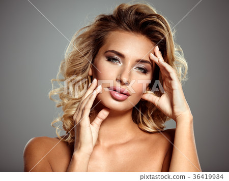 Photo of a beautiful  blond woman with flower 36419984