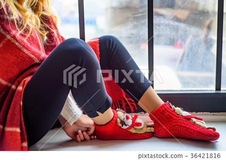 Girl seats on window sill. Cristmas hygge concept. 36421816