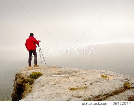Photographer think about picture on peak  36422044