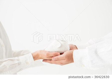 Men and women with baby shoes 36422630