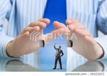 Businessman covered with palms 36423872