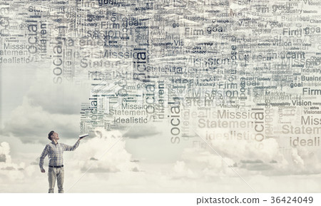 Man with book in hand 36424049