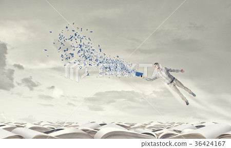 Man with book in hand 36424167