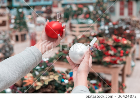 Cheerful happy customer girl choosing Christmas 36424872