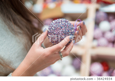 Cheerful happy customer girl choosing Christmas 36424934