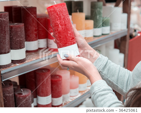 woman hands choosing festive decorative candles woman hands choosing festive decorative candles 36425061