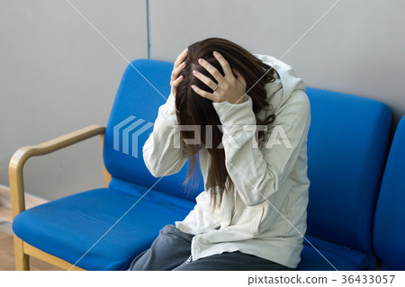 A Japanese woman with a bad headache 36433057