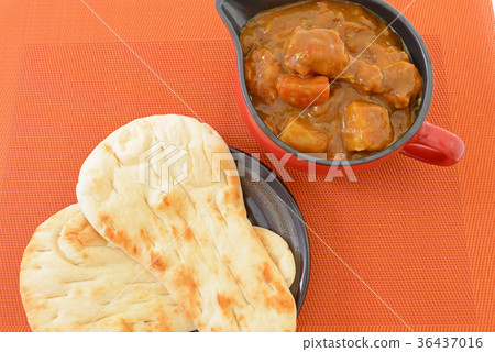 A delicious curry and naan A delicious curry and naan 36437016