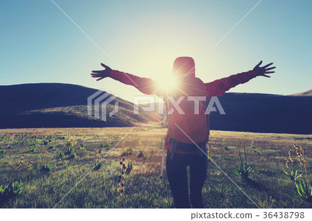 backpacking woman hiking in sunrise mountains backpacking woman hiking in sunrise mountains 36438798