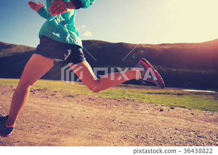 young fitness woman trail runner running outside young fitness woman trail runner running outside 36438822