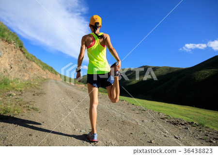 young fitness woman trail runner running on trail 36438823