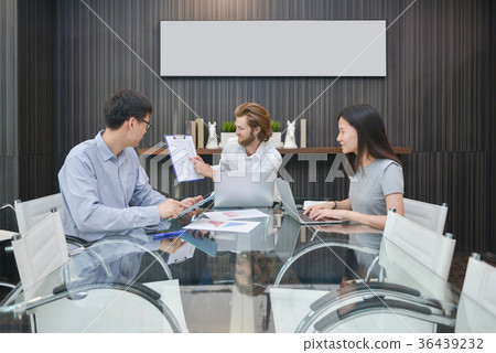 Group of business people meeting in a meeting room, sharing thei 36439232