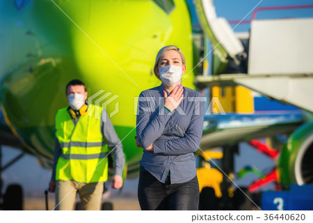 Sick passenger at an airport Sick passenger at an airport 36440620