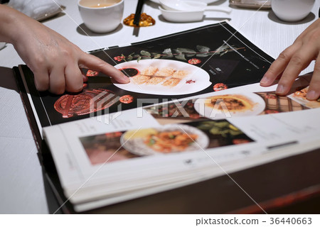 Motion of people looking at menu Motion of people looking at menu 36440663