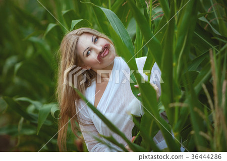Woman jokingly attached herself a mustache. 36444286