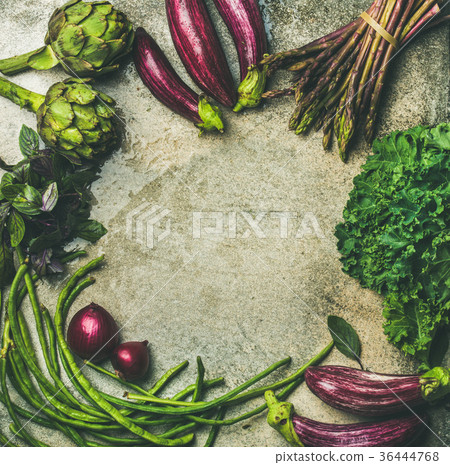 Flat-lay of green and purple raw vegetables over Flat-lay of green and purple raw vegetables over 36444768