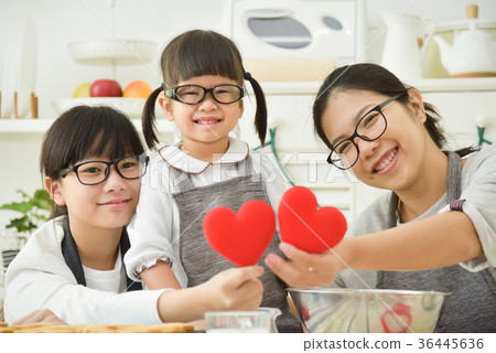 Asian family holding red hearts Asian family holding red hearts 36445636