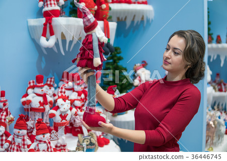 customer girl choosing gifts for Christmas and New 36446745