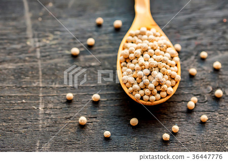 White peppercorn in wooden spoon studio shot White peppercorn in wooden spoon studio shot 36447776