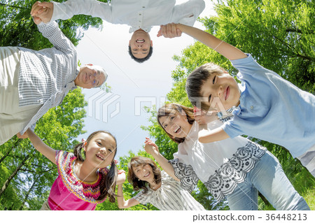 Three generation family playing in the fresh green park 36448213