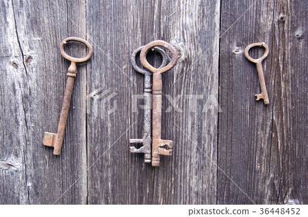 old rusty key on farm barn wooden wall old rusty key on farm barn wooden wall 36448452