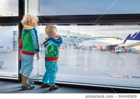 Kids travel and fly. Child at airplane in airport 36448869