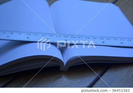 Notebook on the table. 36451565