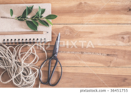 Old scissors notebook and ropes on wooden floor Old scissors notebook and ropes on wooden floor 36451755