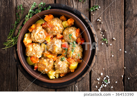 Meatballs stewed with vegetables on wooden table 36453390