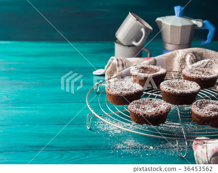 Chocolate winter muffins with icing sugar 36453562