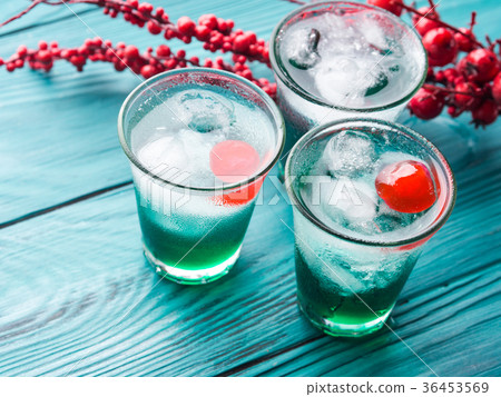 Short alcohol green drinks with cherry Short alcohol green drinks with cherry 36453569