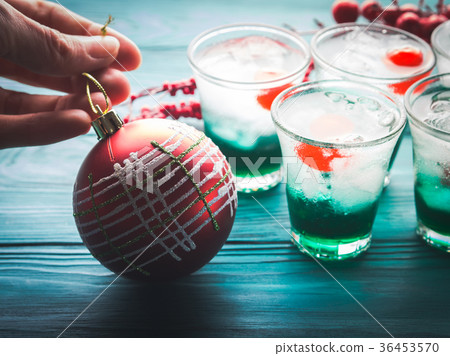 Christmas holiday green drinks and red bauble Christmas holiday green drinks and red bauble 36453570