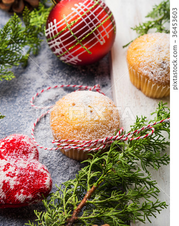 Christmas baking muffins with icing sugar 36453603