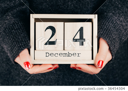 Hands with Christmas Eve date Hands with Christmas Eve date 36454304