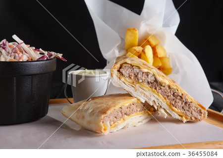 Beef cutlet with cheese rolled in pita 36455084