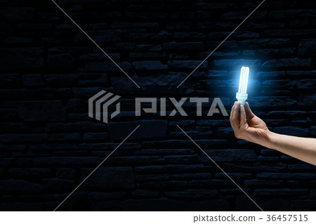 Bright bulb in darkness 36457515