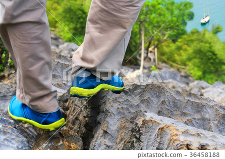 Legs and shoes were walking on the mountain. Legs and shoes were walking on the mountain. 36458188