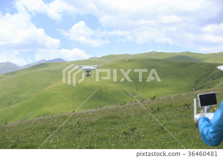 young woman flying drone outdoors young woman flying drone outdoors 36460481