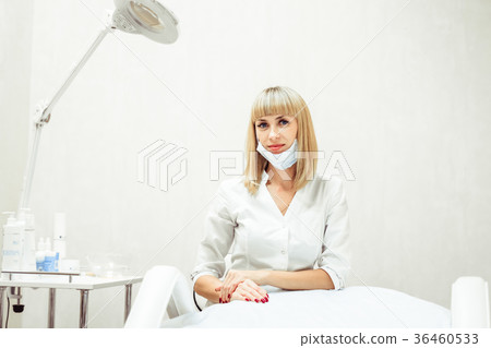 a woman in a lab coat 36460533