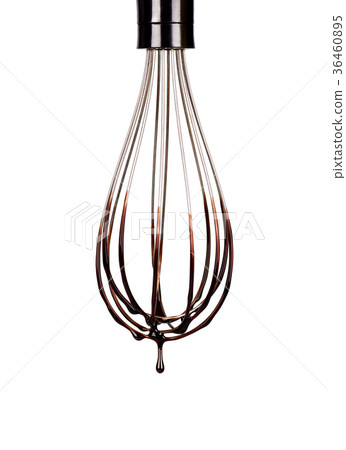 Cookery wire whisk with splashing chocolate Cookery wire whisk with splashing chocolate 36460895